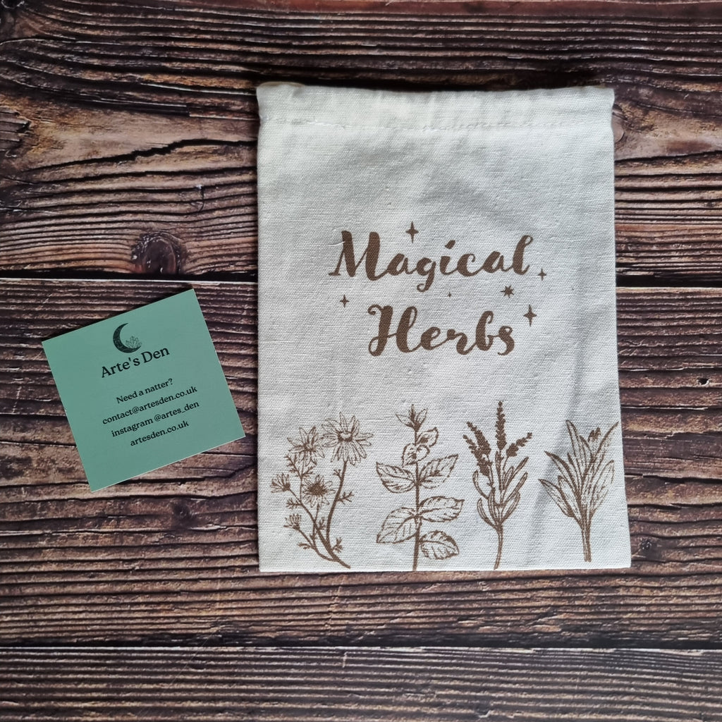 A pale "Magical Herbs" bag with some herb graphics on a wooden background