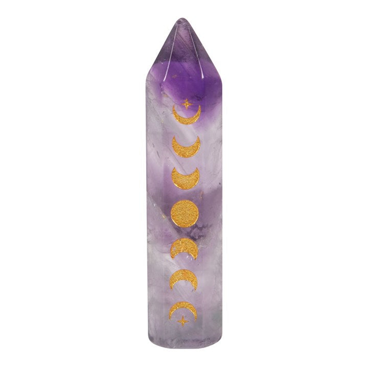 An Amethyst crystal point with gold-tone moon phase engraving