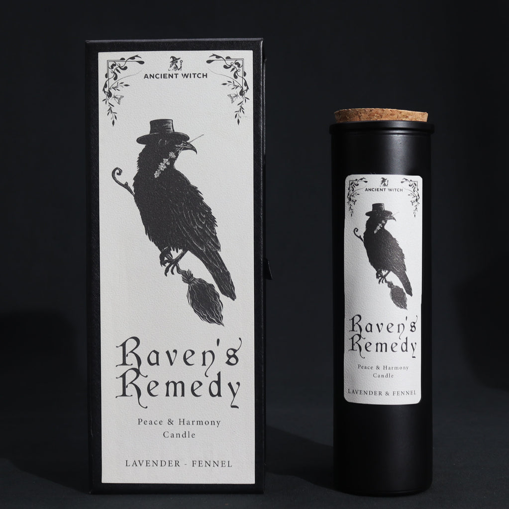 Candle packaging for 'Raven's Remedy' with a black and white design of a raven on a dark background.