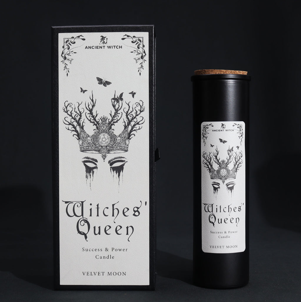 Witches' Queen candle packaging with black and white design on a dark background