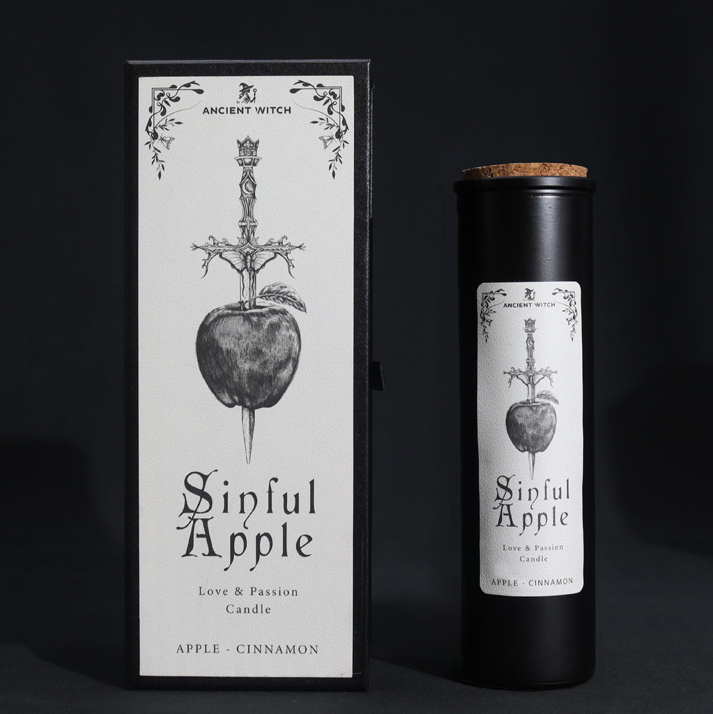 Sinful Apple black candle and box on a black background