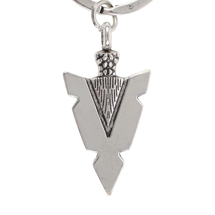 Silver arrowhead-shaped keychain on a white background