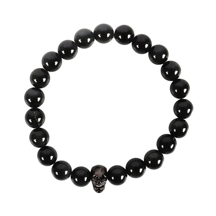 Black Obsidian beaded bracelet and stainless steel skull against a white background 
