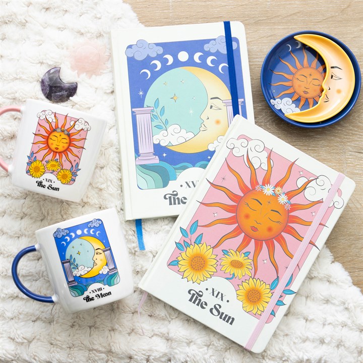 A Celestial Dreams bundle including sun and moon themed notebooks, stacking trinket dish, mugs and crystals 