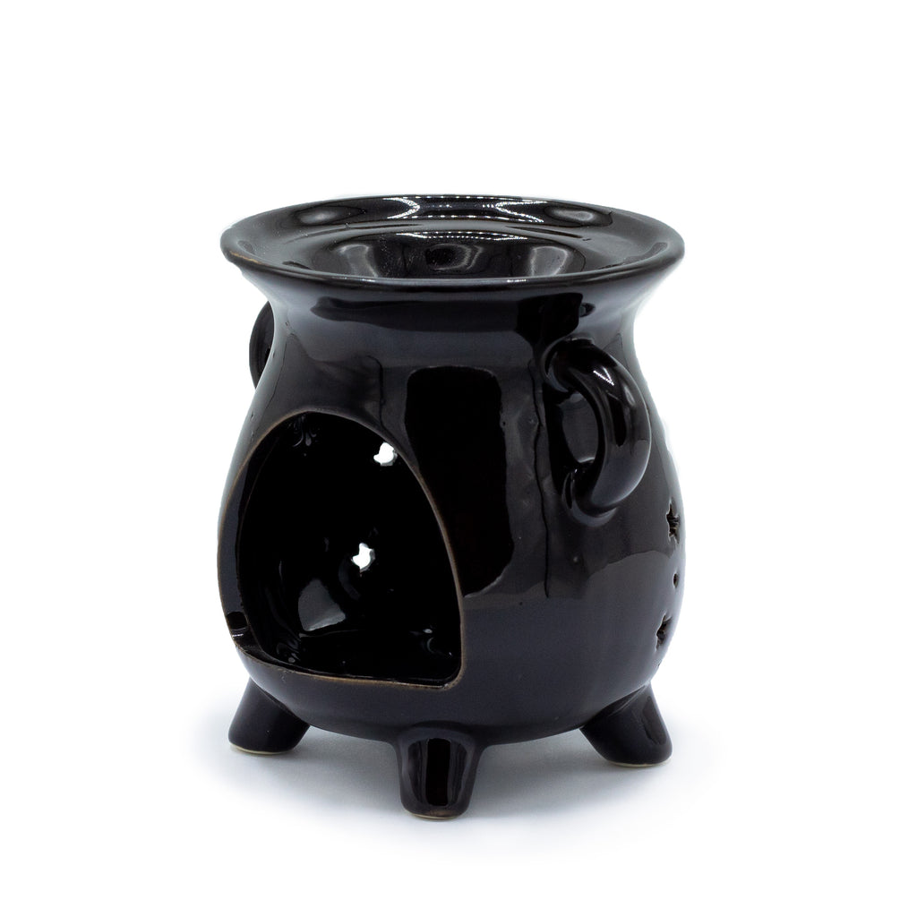 A cauldron style oil burner from the back