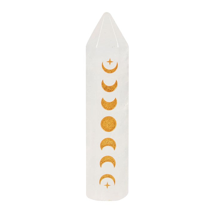 A clear quartz crystal point with a gold-tone moon phase engraving