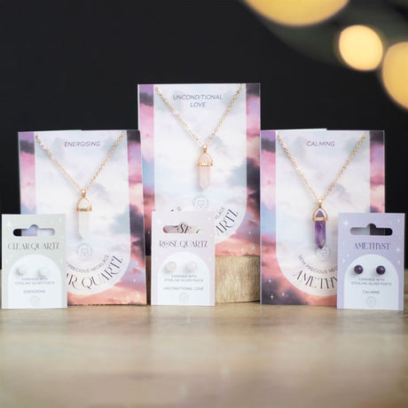 An image showing three cars displaying a crystal necklace each and matching stud earrings