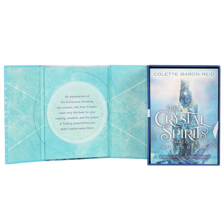 The opened boxed set of 'The Crystal Spirits Oracle' card deck by Colette Baron-Reid with a visual of a crystal-like structure on the cover.