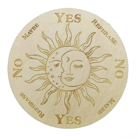 A round wooden divination grid with a sun and moon design with several options around the edge such as "Yes", "no" and "maybe"