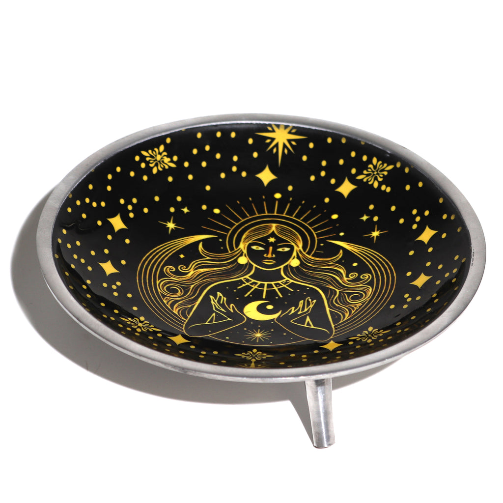 Decorative offering plate with a golden celestial design featuring a goddess, moon, and stars on a black background.