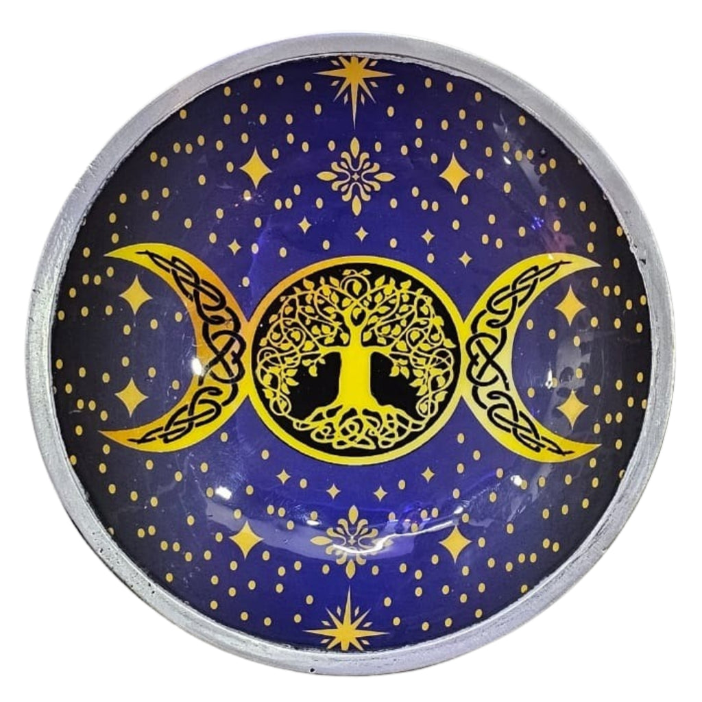 Decorative offering plate with tree of life design and crescent moons on a blue background