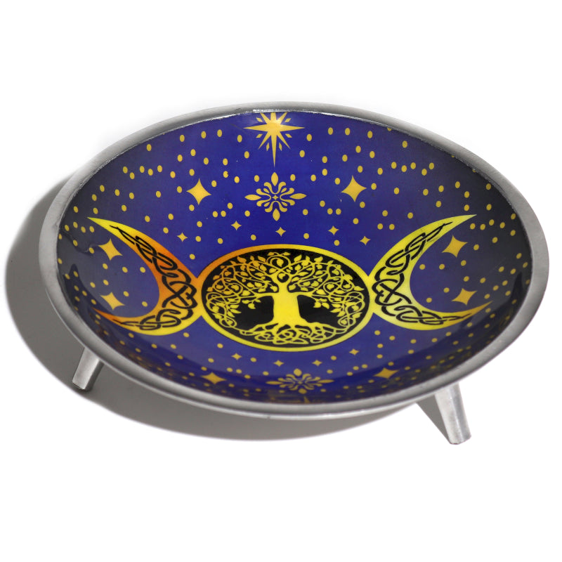 Decorative offering plate with tree of life design and celestial elements on a blue background