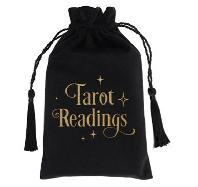 A black silky looking bag with tassels; it has "Tarot Readings" in gold font 