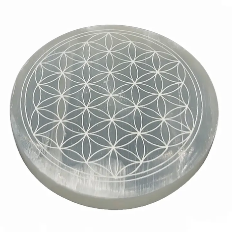 Selenite crystal with Flower of Life pattern on a white background