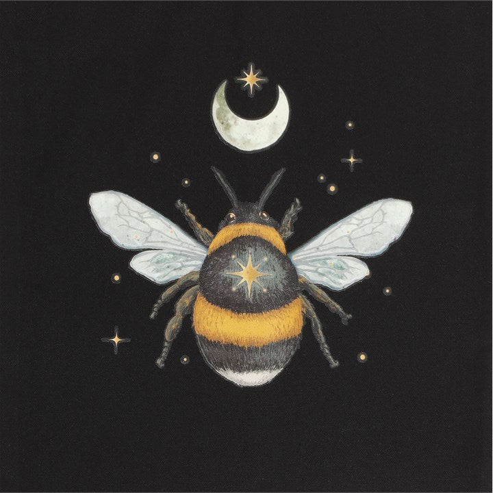 A close up of a black cotton tote bag with a forest bee print.
