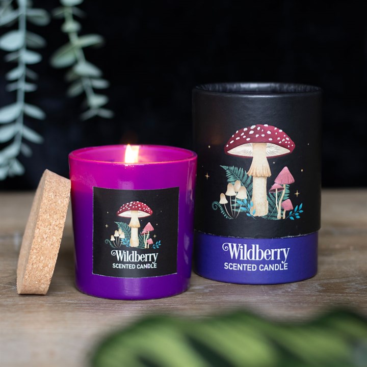 Wildberry Scented candle, shown next to its box; both decorated with a mushroom motif 