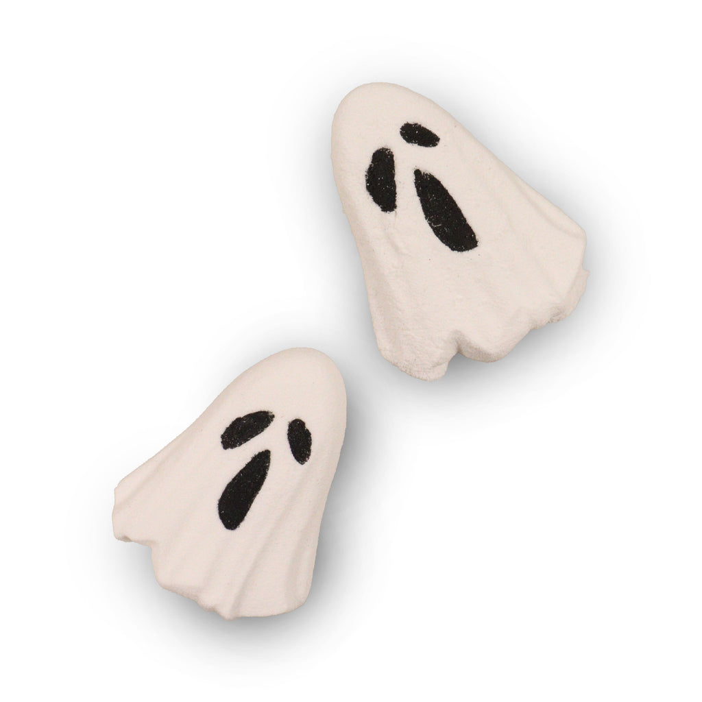 Two ghost-shaped bath bombs on a white background