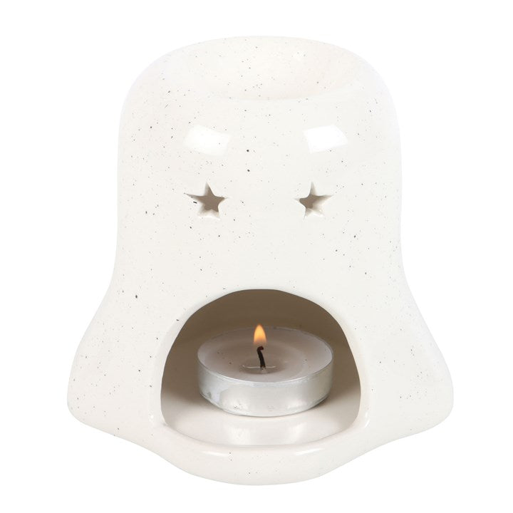A white ghost-shaped oil burner from behind, showing a lit tea light on a white background.