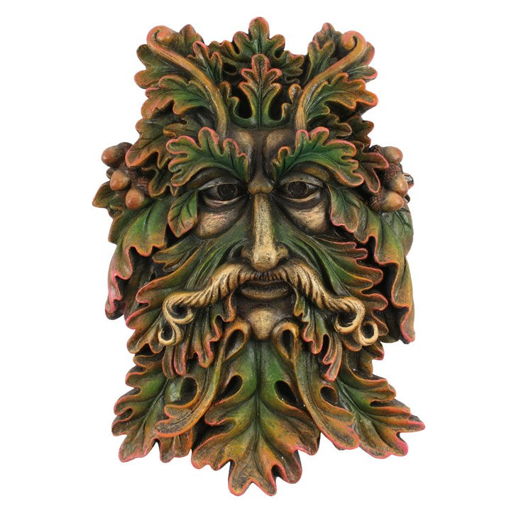 A green man plaque placed against a white background