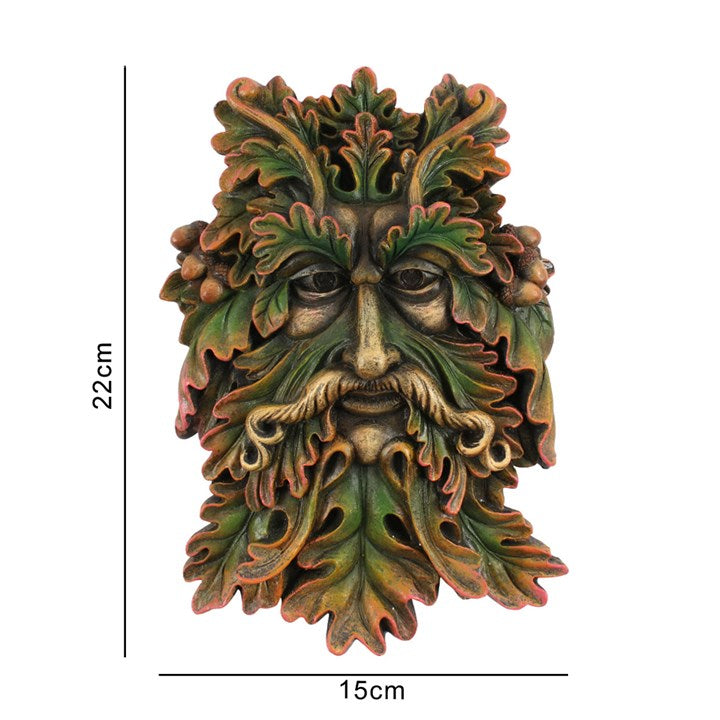 A green man plaque placed against a white background