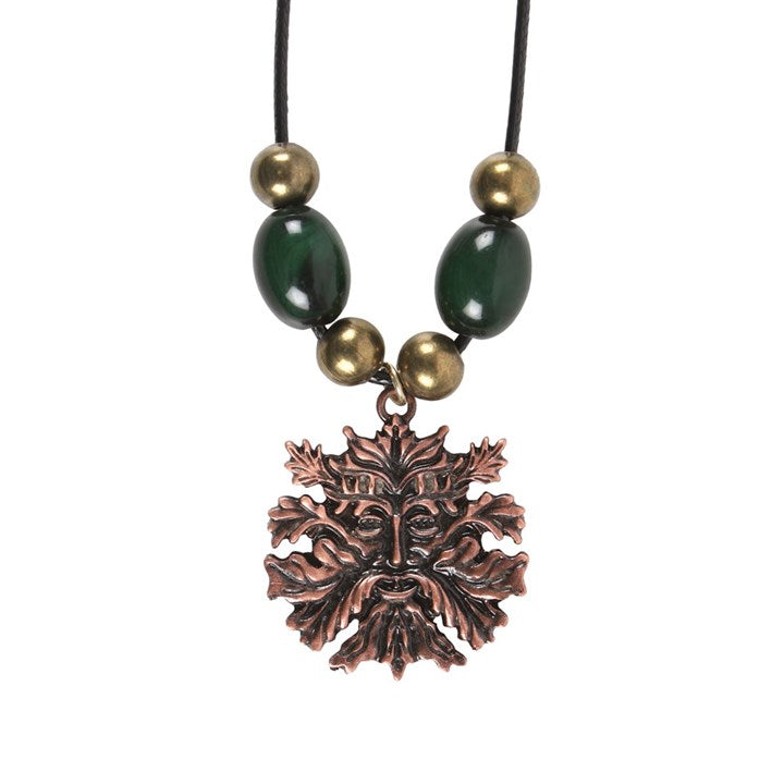 A Green Man pendant necklace with a black rope