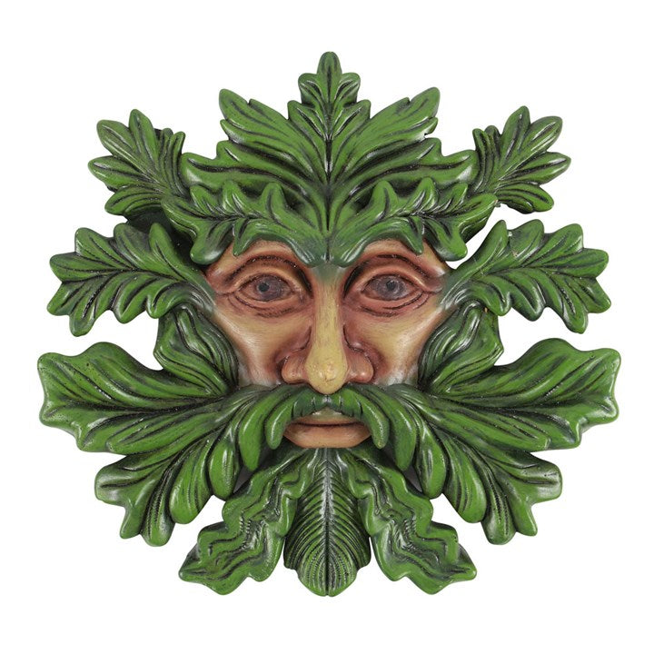 A Green Man themed plaque on a white background