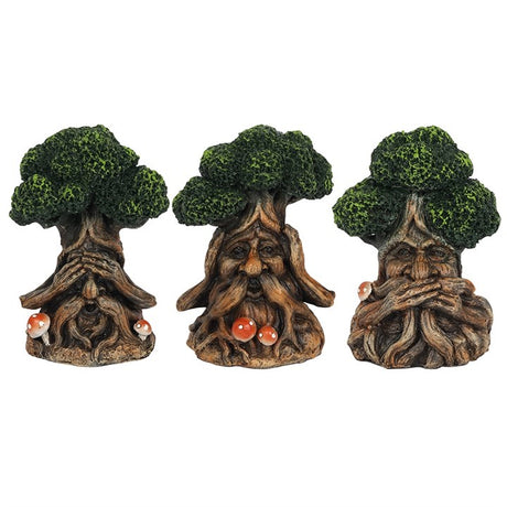 A set of three figurines depicting the Green Man character, each showing one of the "see no evil, hear no evil and speak no evil" saying