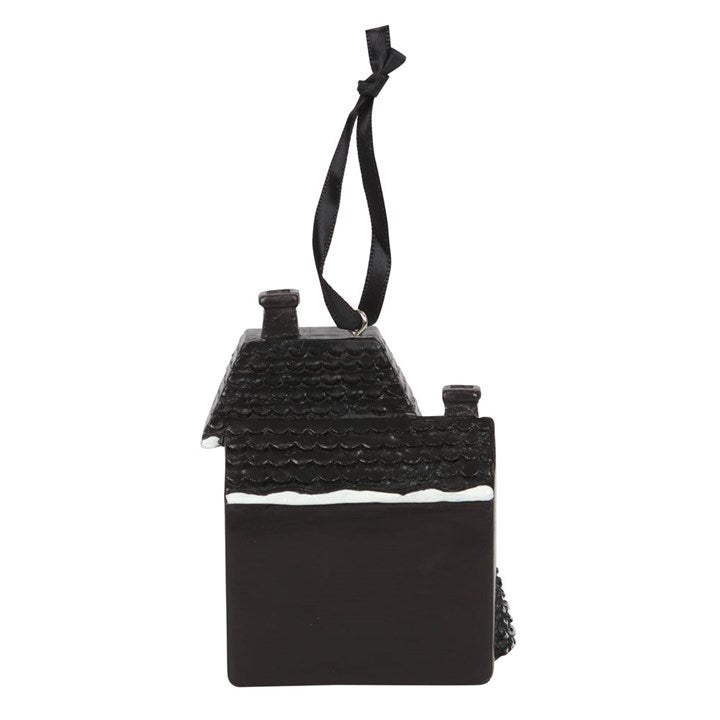 Black "Haunted Holidays" gothic style house on a fabric string for hanging, from back, on a white background.