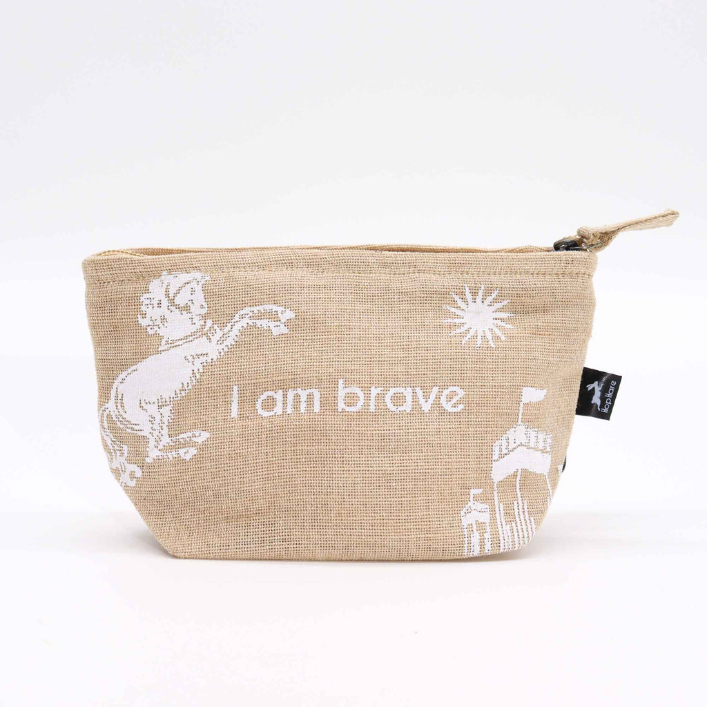A beige jute pouch with an 'I am brave' affirmation in white. 