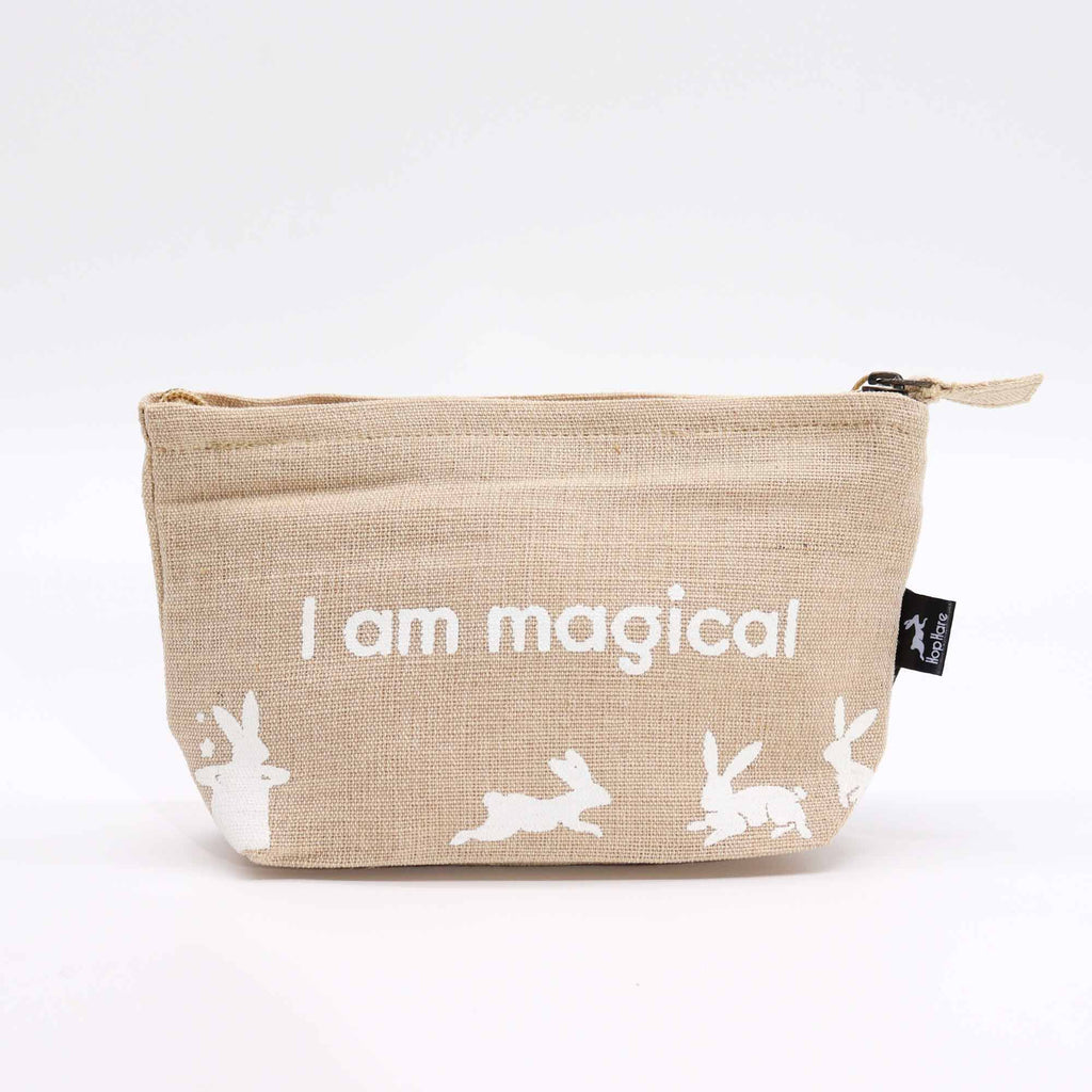 A beige jute pouch with an 'I am magical' affirmation in white. 