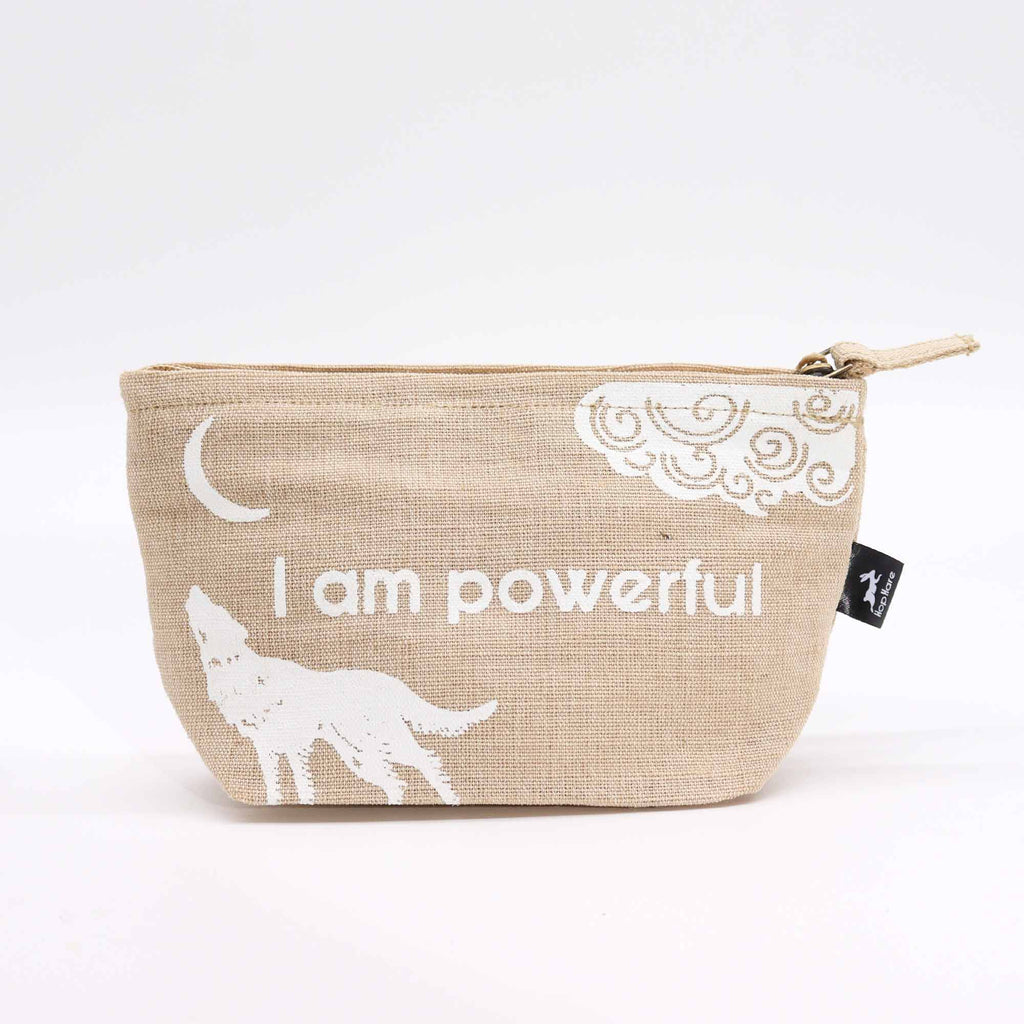 A beige jute pouch with an 'I am powerful' affirmation in white. 
