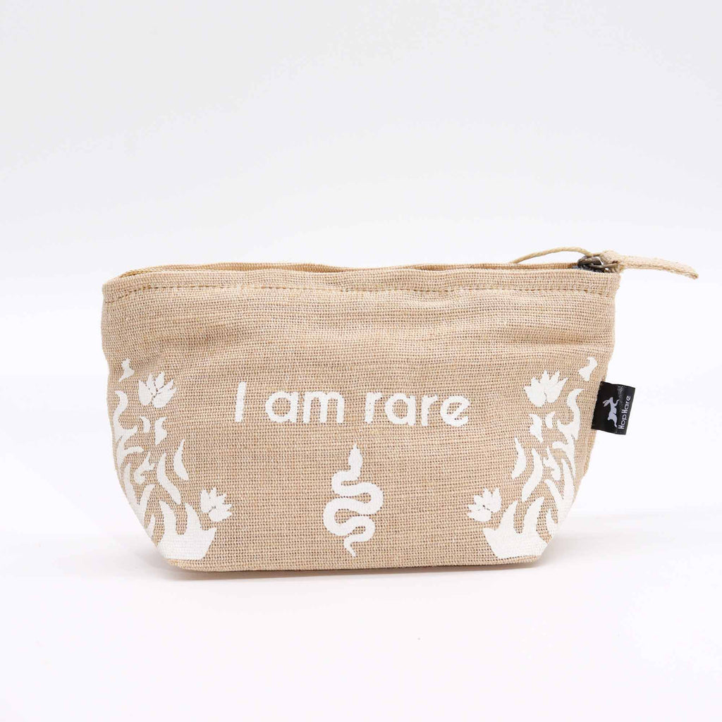 A beige jute pouch with an 'I am rare' affirmation in white. 