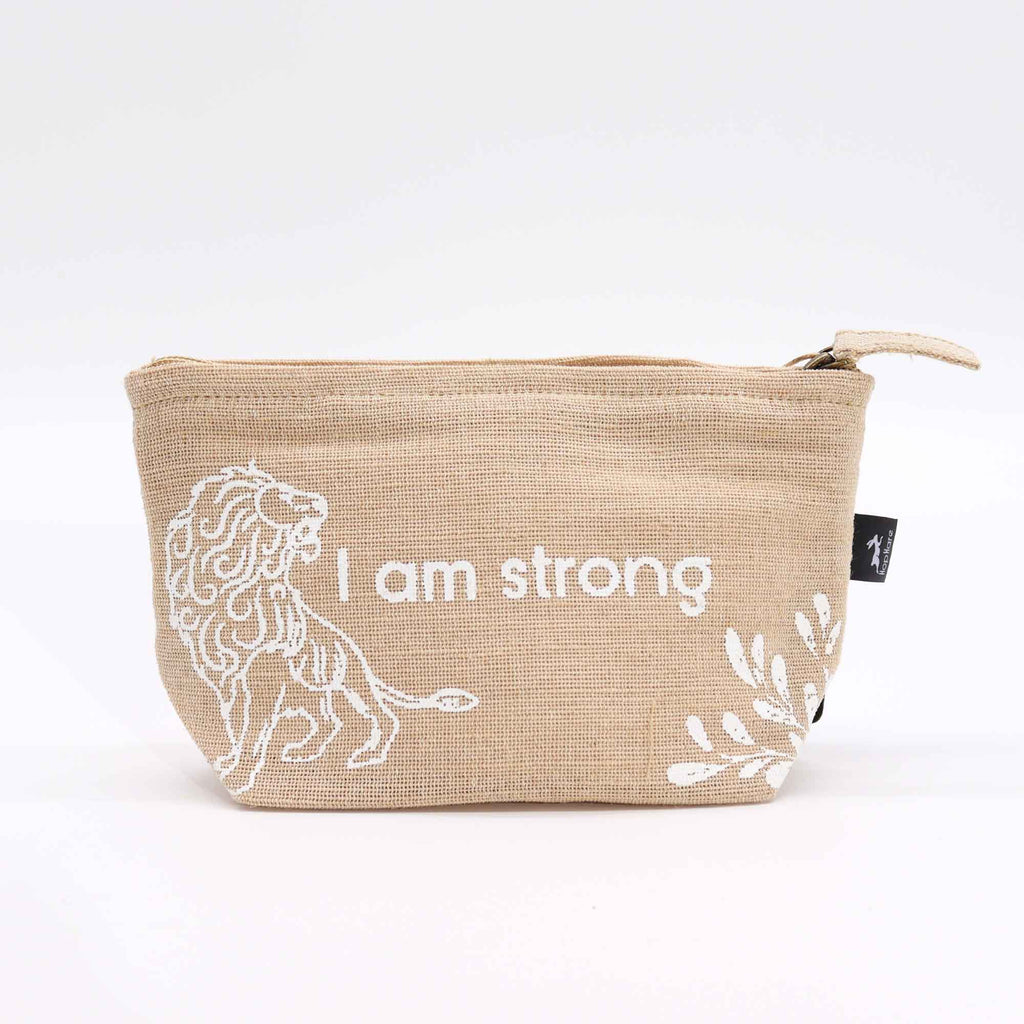 A beige jute pouch with an 'I am strong' affirmation in white. 