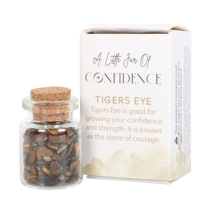 A white matchbox-style gift box labelled 'A Little Jar of Confidence' with a small glass jar filled with tiger's eye crystal chips inside.