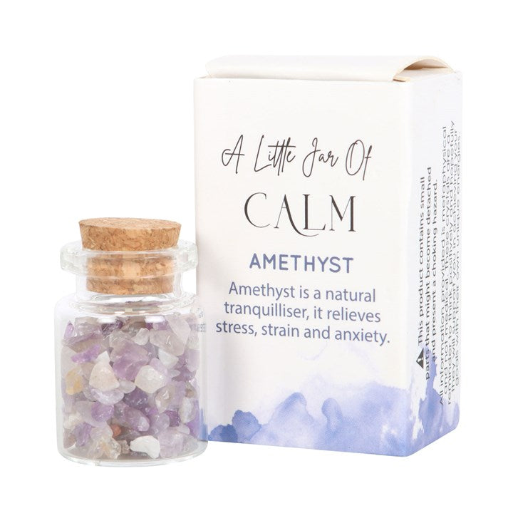 A white matchbox-style gift box labelled 'A Little Jar of Calm' with a small glass jar filled with purple amethyst crystal chips inside.