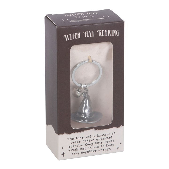 A silver-tone witch hat keyring with a jingle bell in a box.