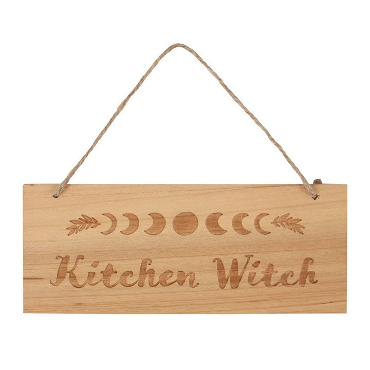 Wooden "Kitchen Witch" rectangular sign with moon phases detailing on a white background. 