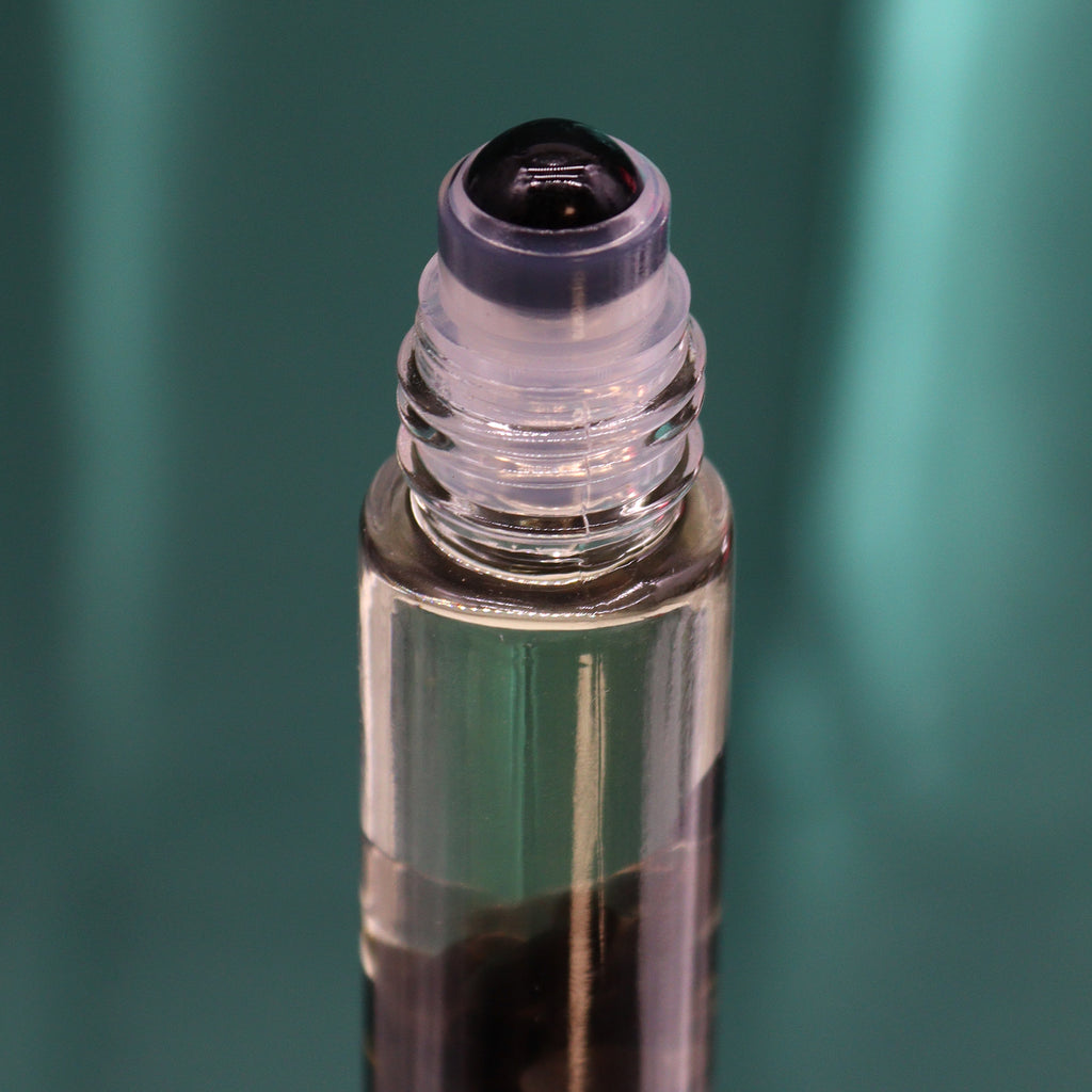 A close up of an essential oil roll on 