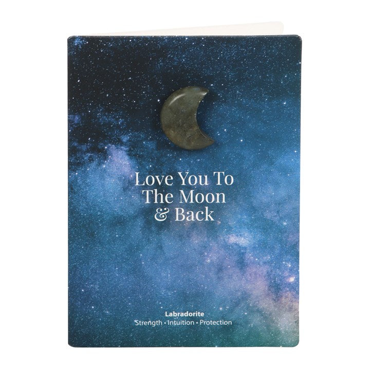 A blue night sky themed card which says "Love you to the moon & back" with a Labradorite crescent moon stuck above it.