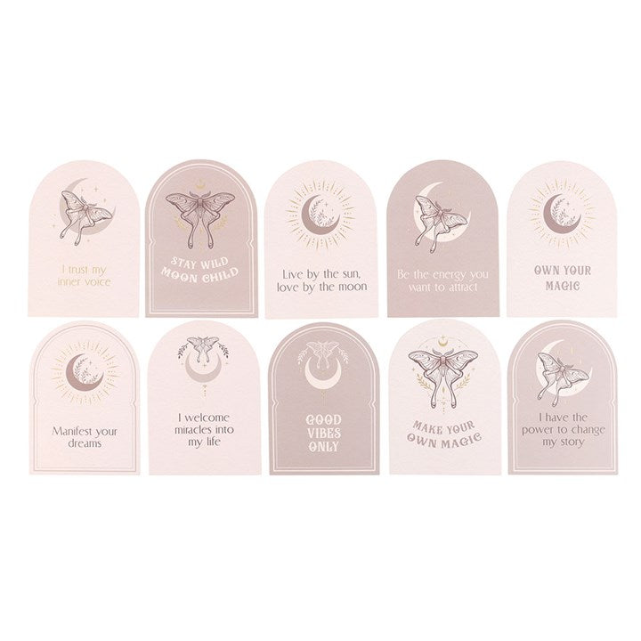Various beige affirmation cards with Luna moth and moon designs and the 