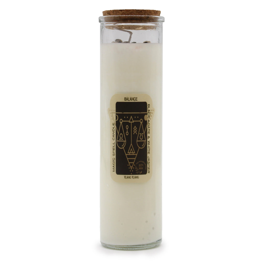 A "Balance" Magic Spell Candle with embedded gemstones. The candles are made of soy wax and have glass containers with cork stoppers.