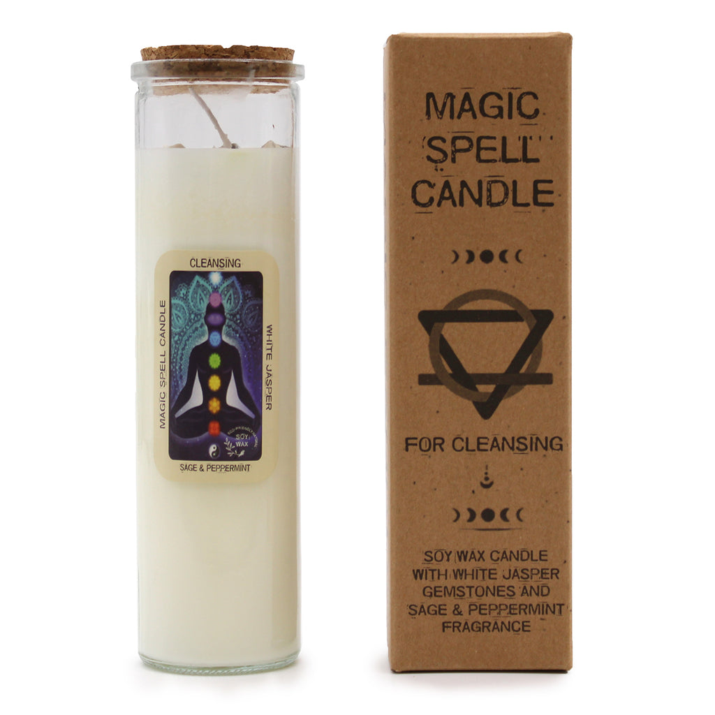 A "Cleansing" Magic Spell Candle with embedded gemstones. The candles are made of soy wax and have glass containers with cork stoppers. It is next to its brown packaging.