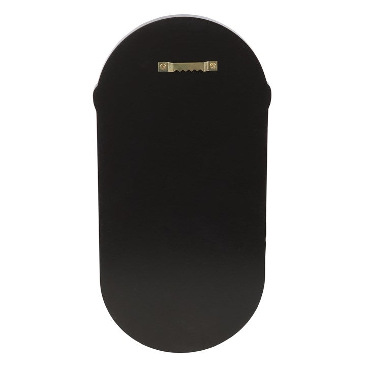 The back of a black wooden altar shelf 