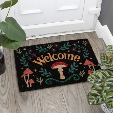 A black mushroom "Welcome" doormat