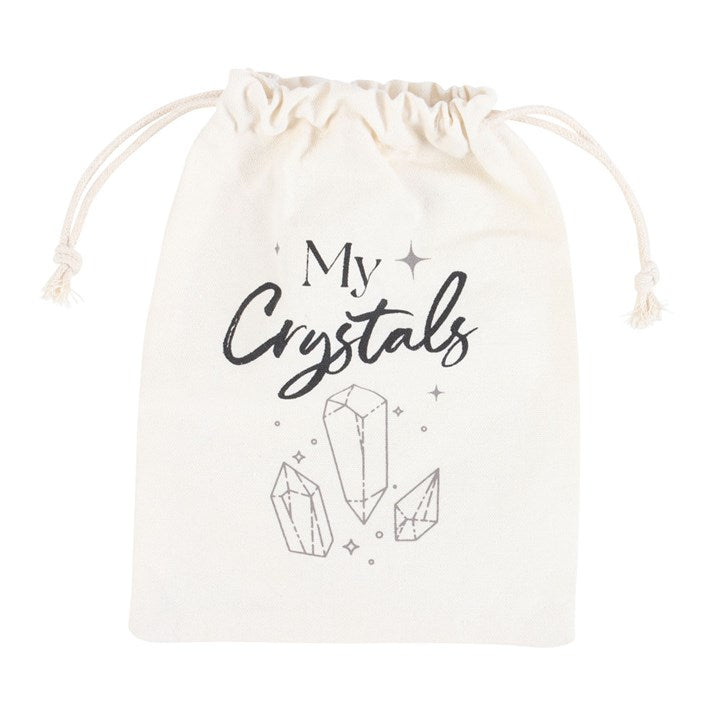 A beige cotton drawstring bag with 'My Crystals' text and a design of crystals printed on it