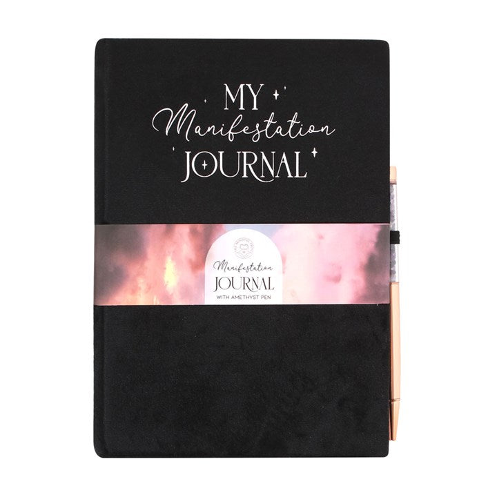 A black journal with "My Manifestation Journal" written at the top. A pen is attached to the side.