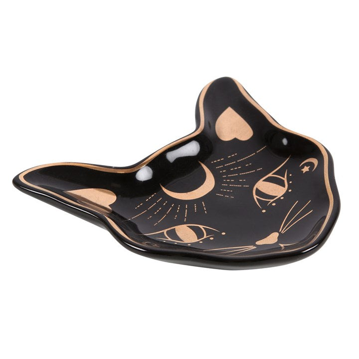 A black trinket dish with gold foil accents, shaped like a stylised cat face.