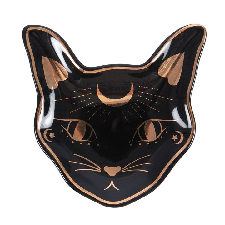 A black trinket dish with gold foil accents, shaped like a stylised cat face.