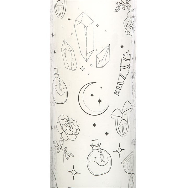 A "Mystical White Sage" glass tube candle with sage, flowers, potion bottles, diamonds and crescent moon decals against a white background. 