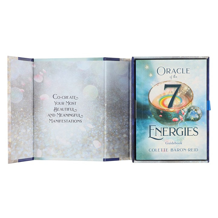 An open boxed set of 'Oracle of the 7 Energies' Oracle Cards by Colette Baron-Reid. The left hand side reads "Co-create your most beautiful and meaningful manifestations" 